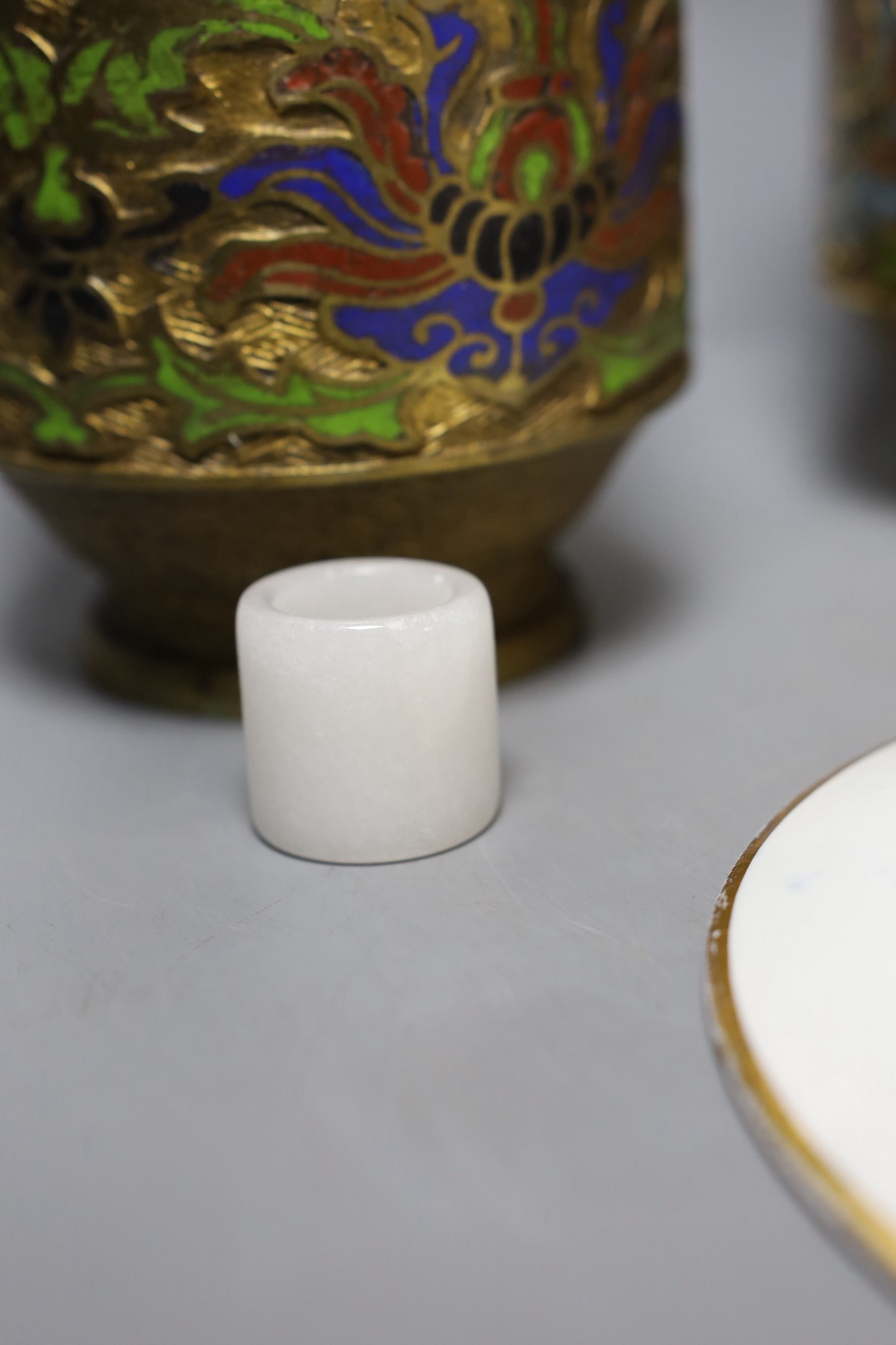 A pair of Japanese champleve enamel vases, a Canton enamel teapot, a jade archers thumb ring (6)